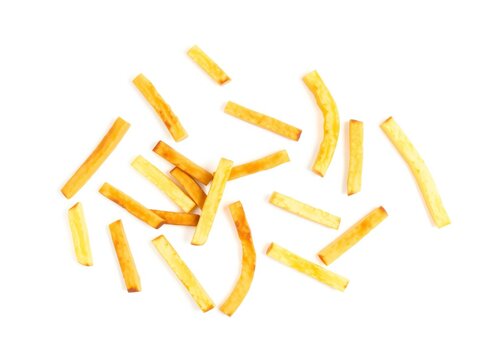 A heap of crispy golden french fries scattered on a surface