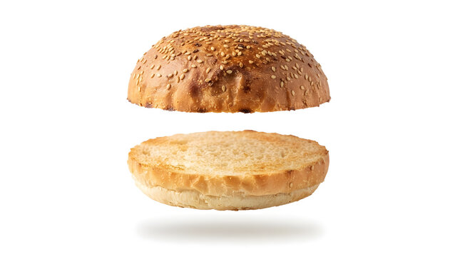 Sliced hamburger bun floating in two halves with sesame seeds on top, isolated on white background