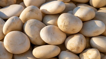 Fototapeta premium Smooth White Stones in Natural Arrangement for Textures, Backgrounds, and Minimalist Design Projects