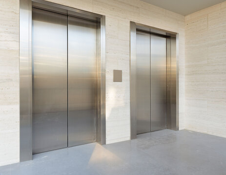 Modern elevator lobby with closed stainless steel doors