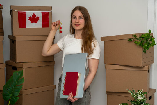 Newcomer Holding Canadian House Key After Relocation