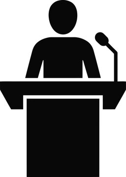 Person speaking at a podium with microphone