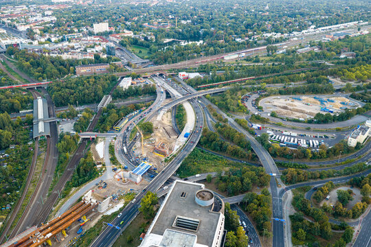 Aerial view of Ringbahnbrucke bridge construction at the Funkturm interchange with surrounding highways, railway tracks, and urban greenery in Berlin, Berlin, Germany.