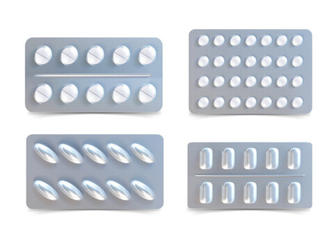 Four blister packs of white pills isolated on a transparent background
