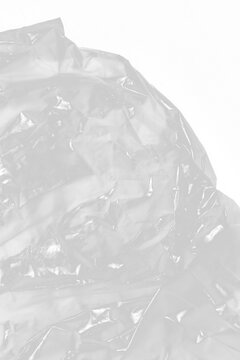Crumpled Transparent Plastic Sheet Texture Background with Glossy Wrinkles and Highlights