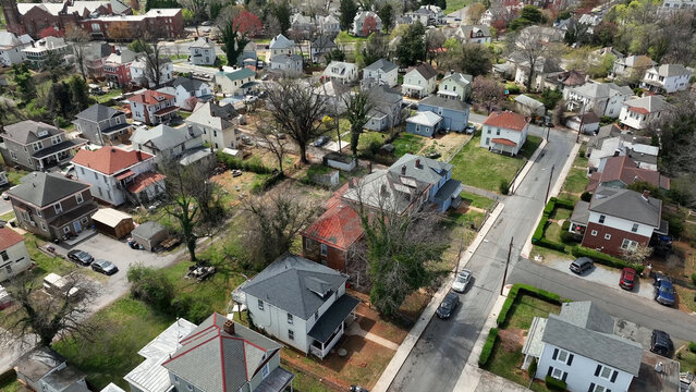 Aerial view of Rivermont Avenue in spring, featuring historic residential houses, lush green trees, and quiet streets in Lynchburg, Virginia, United States.