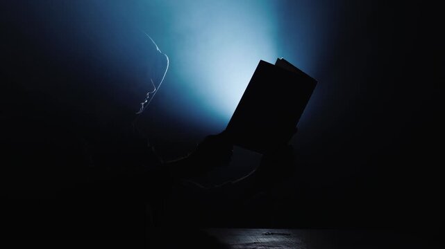 silhouette of a man walking in the night