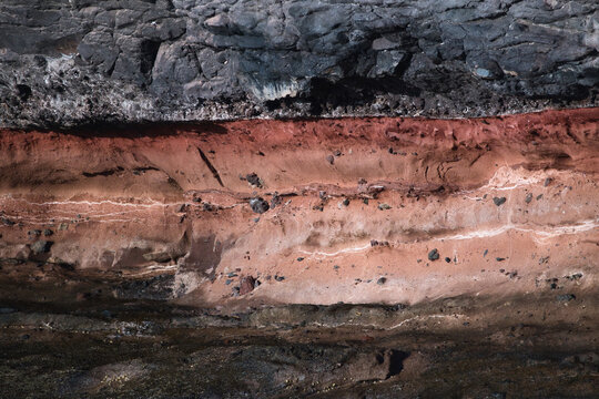 Volcanic Rock Layers with Red Earth and Natural Mineral Texture