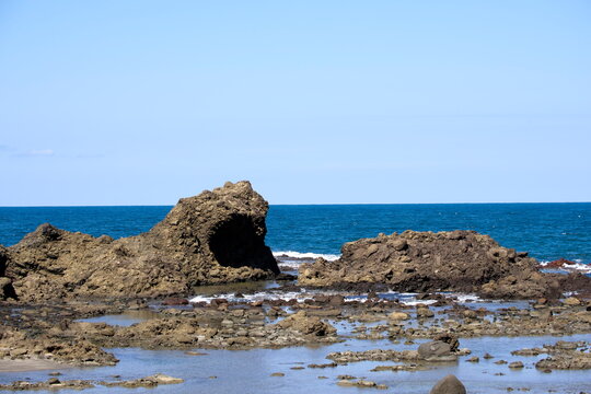 Godzilla Rock volcanic rock formation scenic coast Japan