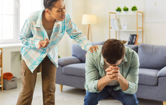 Family deals with frustration, stress, unresolved conflict, lack of connection. Woman talks with support and empathy to upset man struggling with relationship burnout and mental health problems