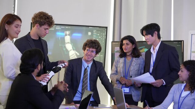 Smiling engineer in suit and tie leans on the meeting table as colleagues holding a bionic hand and reports discuss the project, while ideas are exchanged, a modern AI business scene
