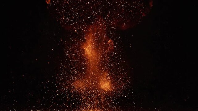 Explosive Fireball Bloom in cinematic slow motion during dark night with embers flying outwards
