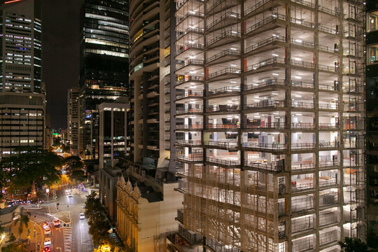 A refurbishment of a multi-level building showing the exposed floors during the night