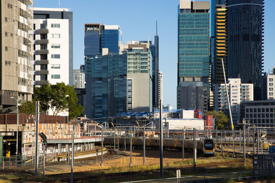 Roma Street rail complex surrounded by large buildings in the Brisbane city centre