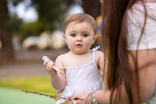 Curious toddler outdoors with mum