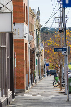Urban streetscape with historic buildings and overhead power cables