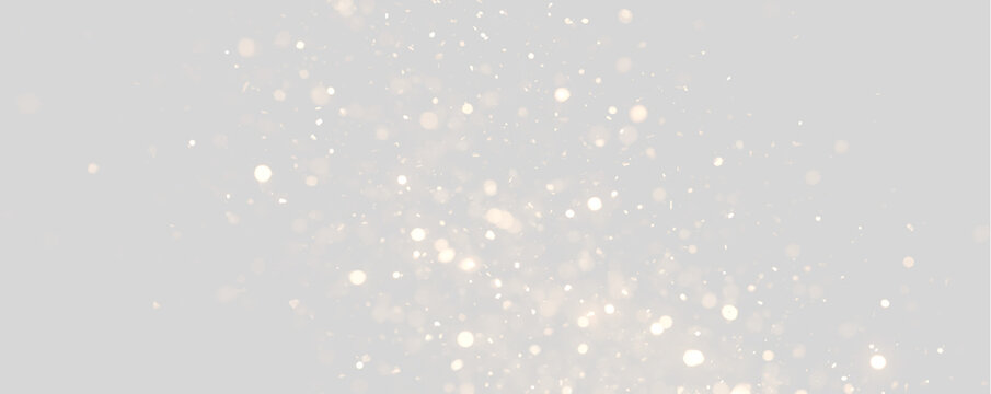 Glowing gold sparkles and bokeh particles drifting upwards. Luminous shimmering glitter overlay on transparent background