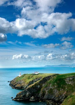 Baily Lighthouse on a stunning green cliff in Howth Ireland
