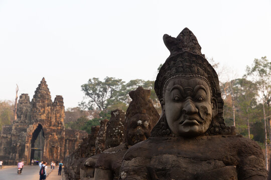 Ancient stone demon statues at Angkor Thom Cambodia