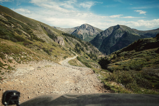 Point of view driving on a rugged mountain pass