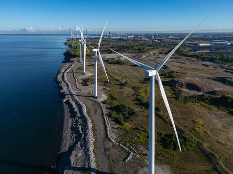 Wind turbines generating clean energy along a coastline