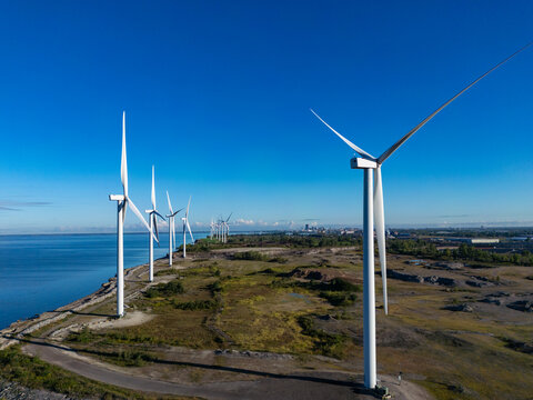 Wind turbines generating clean energy along the coast