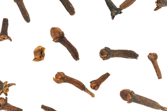 Dry clove buds falling creating a spice background