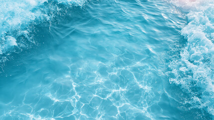 Fototapeta premium Crystal clear blue ocean water with sun reflections and gentle waves, ideal for summer relaxation backgrounds.
