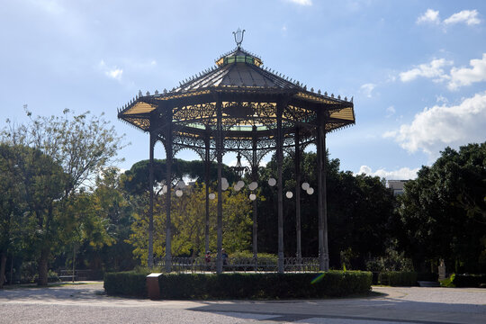 Catania, Italy; 1st September 2026: Scenic view of Parco Maestranze in Catania with lush Mediterranean trees and historic architecture