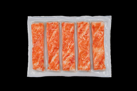 Crab meat in vacuum package isolated on black background. Crab meat isolated.
