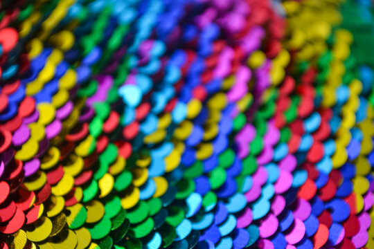 Colorful shiny sequin fabric texture background macro close up