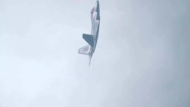 F-22 Raptor Fighter Aircraft in Dynamic Midair Maneuver