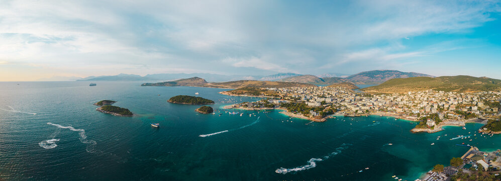 Aerial panorama of Ksamil coastline in islands boats and waterfront