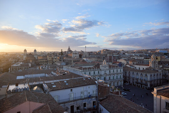 Aerial view of Piazza del Duomo in Catania at sunset with historic architecture and city life