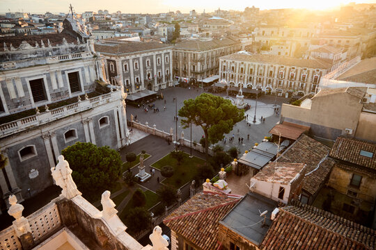 Aerial view of Piazza del Duomo in Catania at sunset with historic architecture and city life