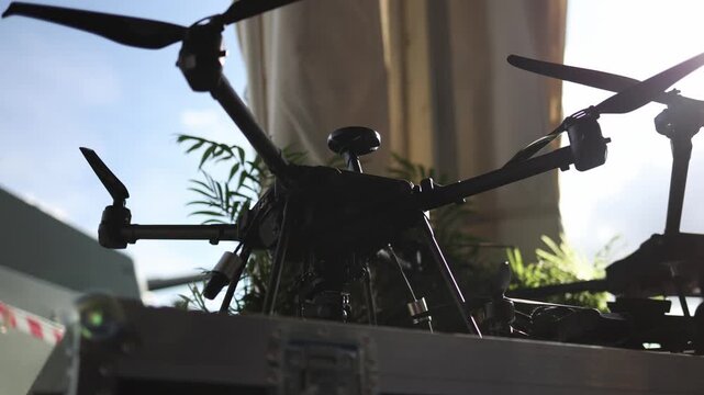 Military surveillance drone with camera sensor and multirotor design displayed as advanced unmanned aerial technology for reconnaissance observation and field missions