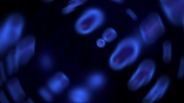 Spinning blue blurred shapes rotating in continuous cellular abstract background. Seamless Looped