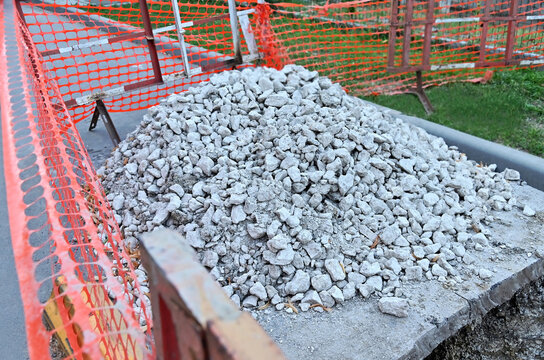 Concrete rubble and safety netting on water pipeline repair