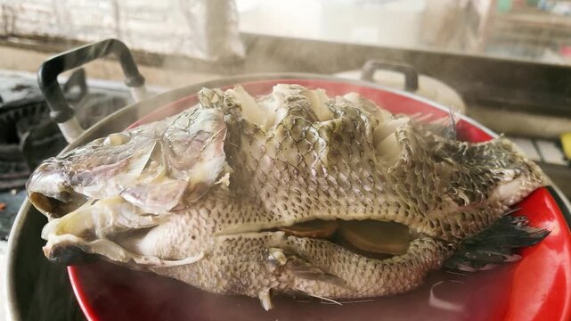 Slow Motion of Steaming Hot Steamed Tilapia Fish Fresh from Pot