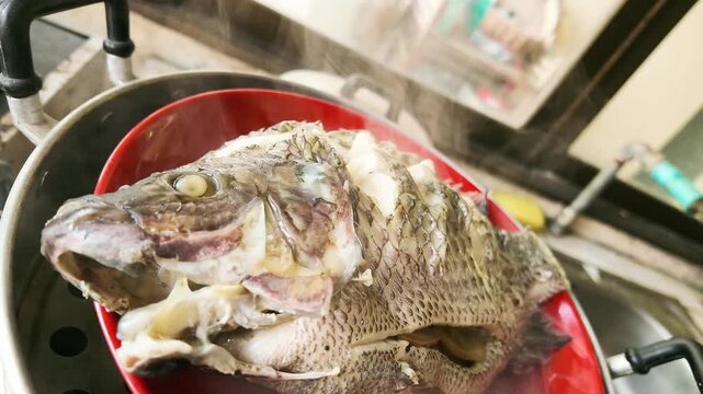 Slow Motion of Steaming Hot Steamed Tilapia Fish Fresh from Pot