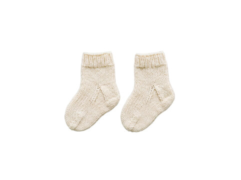 Hand knitted white baby socks on neutral background | Handmade wool booties for newborn | Organic cotton baby clothing flat lay | Cozy winter accessories for infants