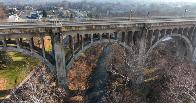 Aerial view of the Hamilton Street Bridge spanning the Lehigh River with bare winter trees and urban surroundings in Allentown, Pennsylvania, United States.