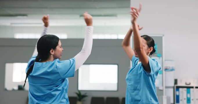 Dancing, happy and team in hospital with fun, surgical achievement and celebration for shift end. Success, women and nurse with laugh, healthcare breakthrough and playful groove with completed work.