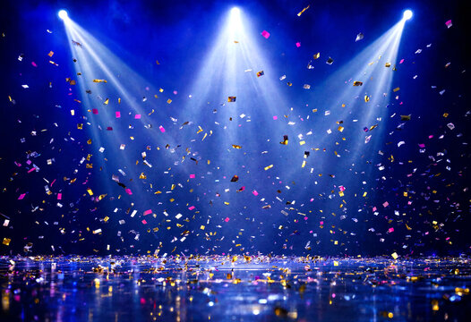 Colorful confetti falling under bright stage spotlights celebration scene
