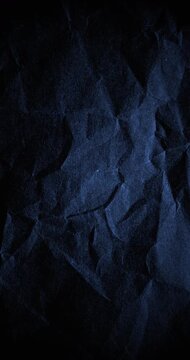 Dark Blue Crumpled Paper Stop Motion Texture. Crumpled paper texture shifts in stop motion animation tinted deep blue. Angular folds create dark tactile abstract surface.