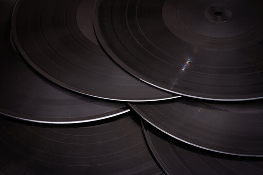 Group of black vintage records. Vinyl records texture, music background. View of phonograph records.
