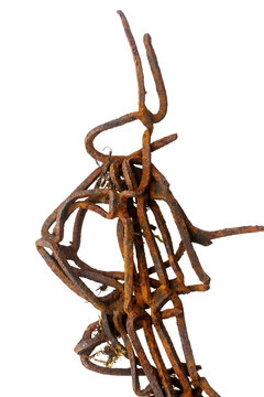 Part of old unknown rusty object isolated on white background. The usual metal detecting find.