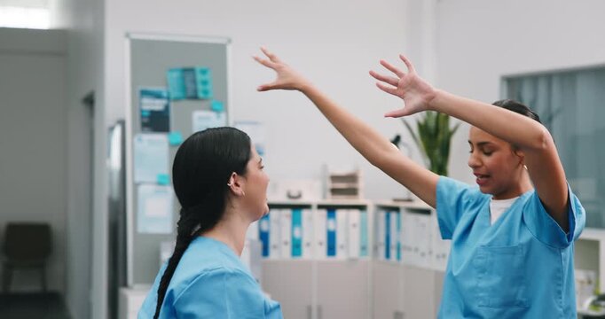 Dance, happy and team in hospital with fun, surgical achievement and celebration for shift end. Success, women and nurse with groove, healthcare breakthrough and playful moment with completed work.