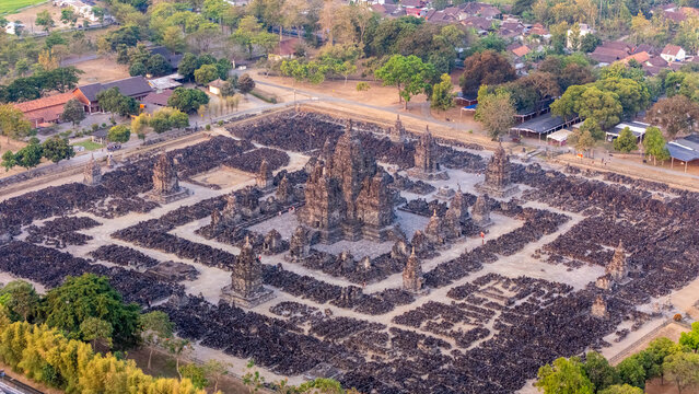 Aerial view of Sewu Temple, an ancient Buddhist temple complex with a central shrine surrounded by rows of smaller stupas, set in Kecamatan Prambanan, Jawa Tengah, Indonesia.