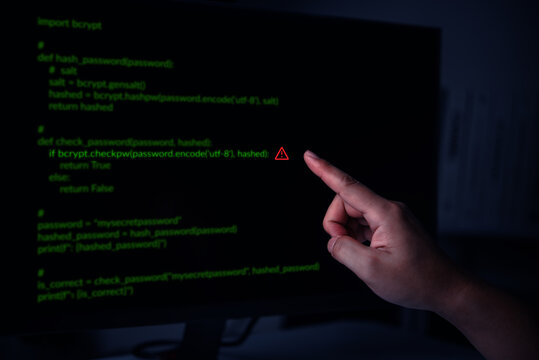 Hand Pointing at Password Code with Cybersecurity Warning